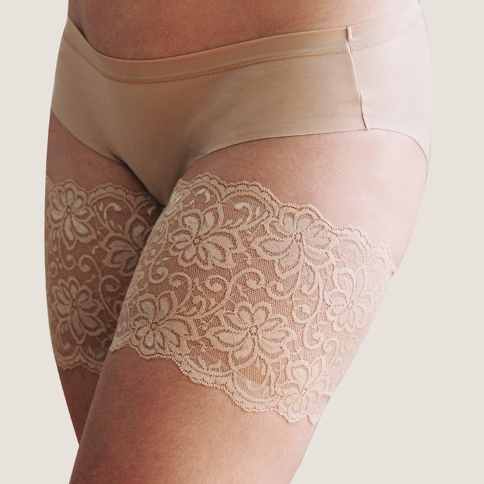beige lace bandelettes thigh bands close up floral pattern side angle
